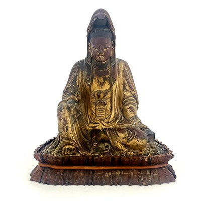 Lot 619 - A Chinese carved giltwood figure of Guanyin,...