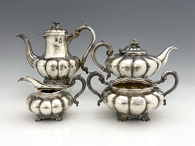 Lot 492 - A William IV silver matched four-piece tea and...