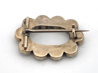Lot 19 - A Regency garnet brooch, oval form, set with...