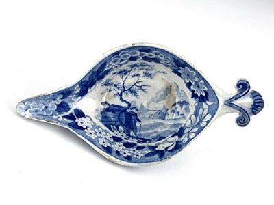 Lot 959 - A pearlware blue and white pap boat, circa...