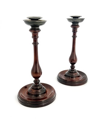 Lot 266 - A pair of George III mahogany candlesticks,...