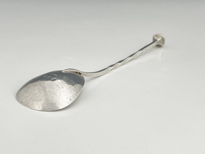 Lot 92 - A E Jones, an Arts and Crafts silver spoon,...