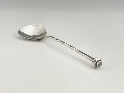 Lot 92 - A E Jones, an Arts and Crafts silver spoon,...