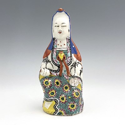 Lot 585 - A Chinese famille rose figure of Guanyin,...