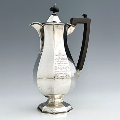 Lot 244 - A George V silver octagonal hot water jug, of...