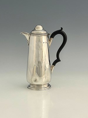 Lot 245 - A George V silver hot water jug, of...