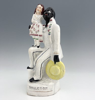 Lot 1047 - A Staffordshire figure of 'Uncle Tom' and...