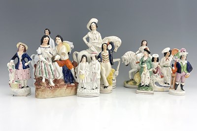 Lot 1068 - A collection of Staffordshire figures,...