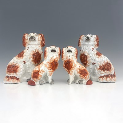 Lot 1029 - A Staffordshire figure group of spaniels,...