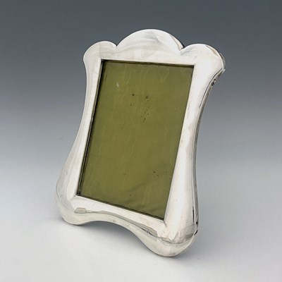 Lot 254 - An Edwardian silver-mounted photograph frame,...