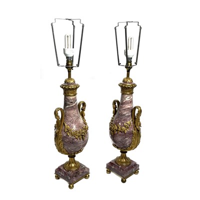 Lot 291 - A pair of pink veined marble table lamp bases,...