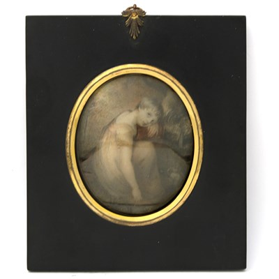 Lot 221 - A portrait miniature depicting a young, seated...