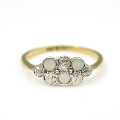 Lot 17 - An Edwardian diamond and opal ring, on 18ct...