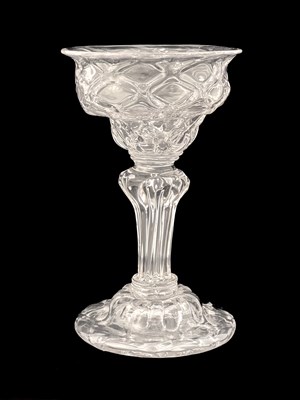 Lot 660 - A diamond moulded sweetmeat glass, circa 1740,...