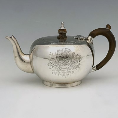 Lot 164 - A Victorian silver teapot, of bullet shape...