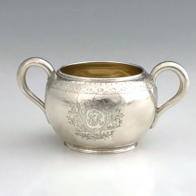 Lot 156 - A Victorian silver sugar bowl, with dual loop...