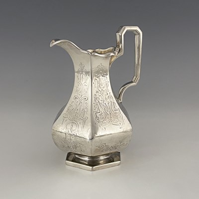 Lot 185 - A Victorian silver cream jug, of panelled...