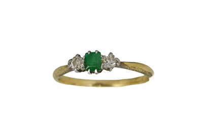 Lot 16 - An 18ct gold, diamond and emerald ring, the...
