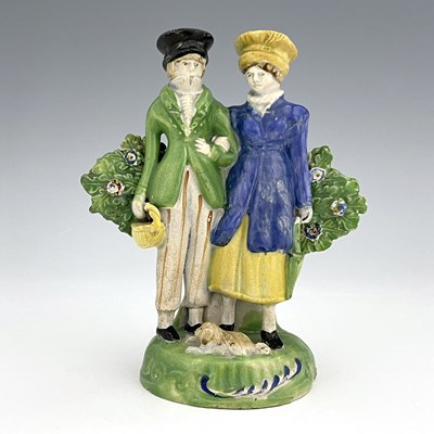 Lot 1033 - A Staffordshire pearlware figure group of the...