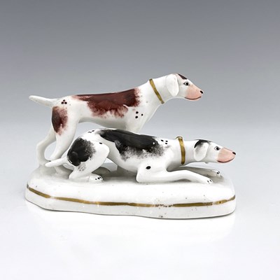 Lot 1076 - A Staffordshire porcelain figure group of two...