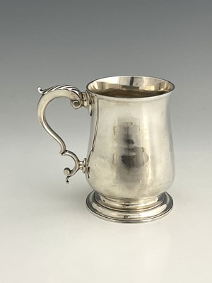 Lot 16 - A George III silver pint mug, of baluster form,...