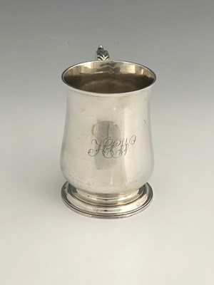 Lot 16 - A George III silver pint mug, of baluster form,...