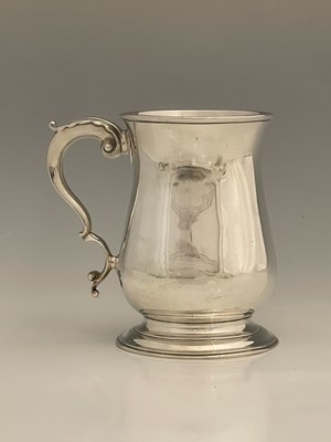 Lot 18 - A George III silver mug, of baluster form, the...