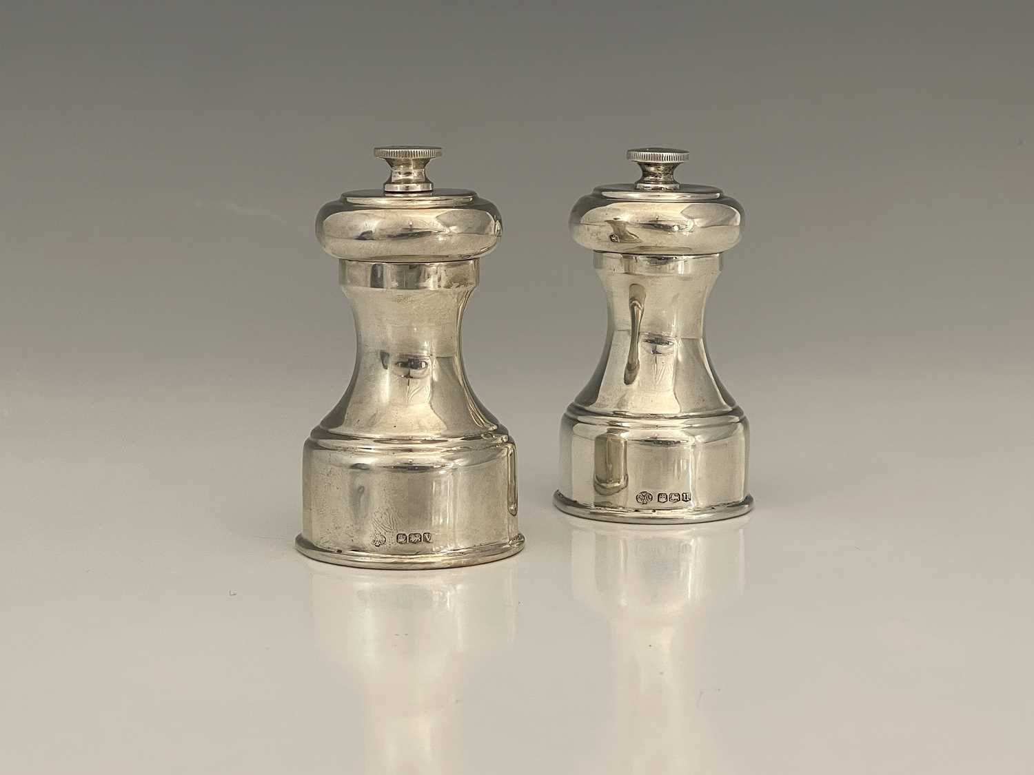 Lot 19 - A pair of Elizabeth II silver-mounted pepper...