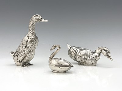 Lot 67 - Two silver-coloured metal figures of ducks,...
