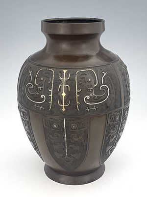 Lot 625 - A Chinese Qing bronze baluster vase, the body...