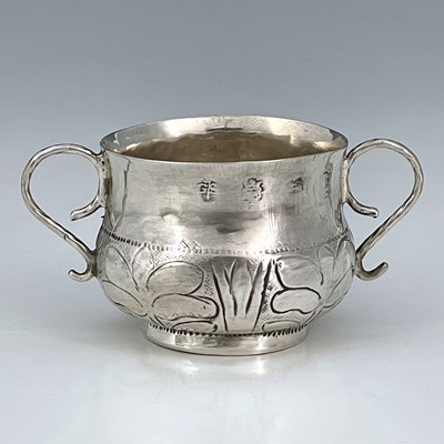 Lot 117 - A Charles II silver porringer, of ogee form,...