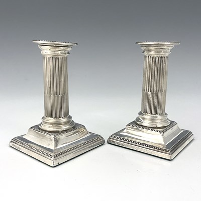 Lot 131 - A pair of Victorian silver candlesticks, with...