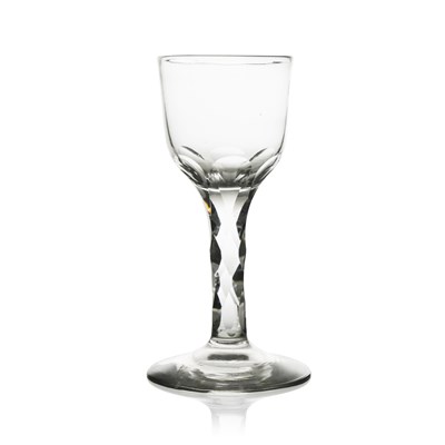 Lot 499 - A facet stem wine glass, circa 1790, the ogee...