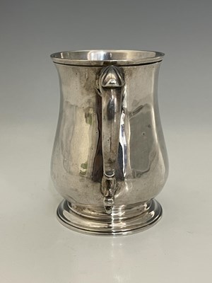 Lot 96 - An early George III silver mug, of baluster...