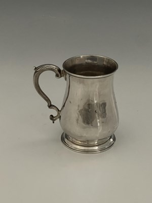 Lot 96 - An early George III silver mug, of baluster...