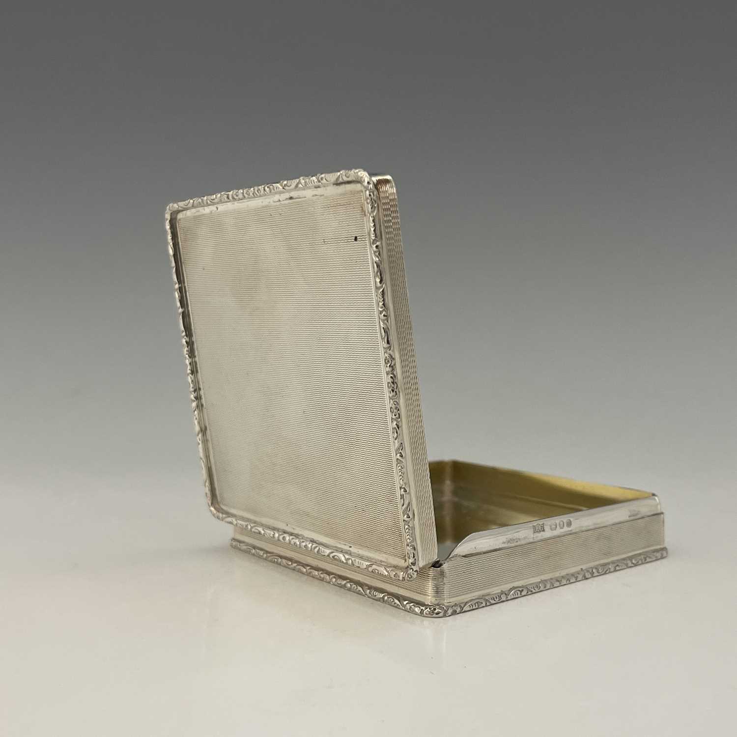Lot 23 - An Elizabeth II silver box, of squat cuboid...