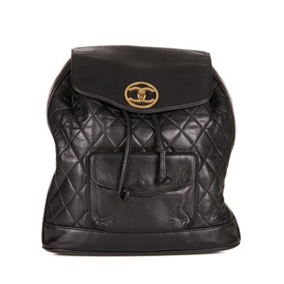 Lot 264 - Chanel, a vintage black quilted leather backpack w/pouch