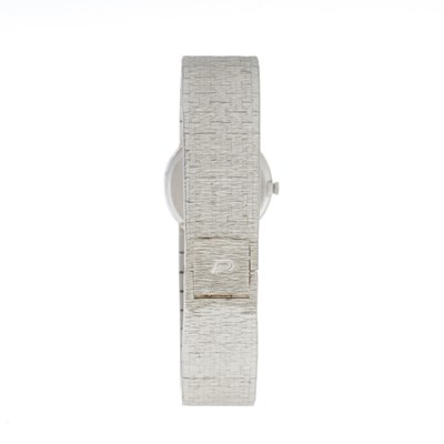 Lot 242 - Piaget, an 18ct white gold lapis lazuli bracelet watch