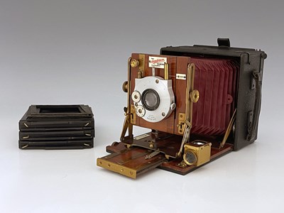 Lot 341C - A Sanderson 4x5 Field concertina camera, red...