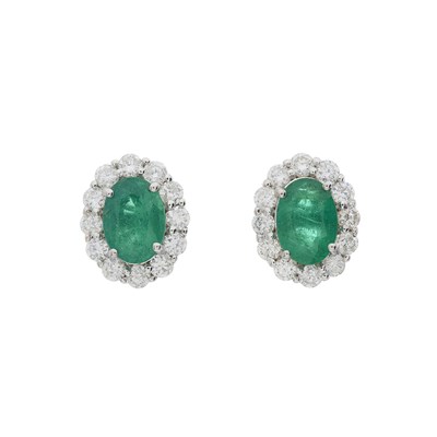 Lot 59 - A pair of 18ct gold emerald and diamond cluster stud earrings