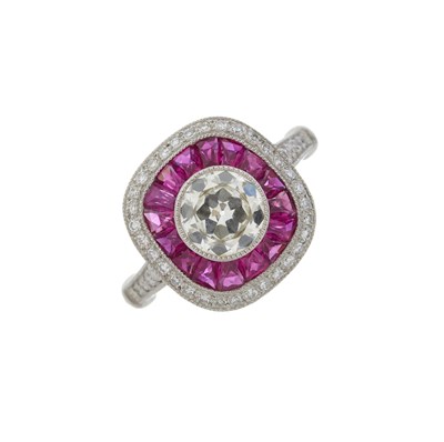 Lot 47 - A platinum diamond and ruby cluster dress ring
