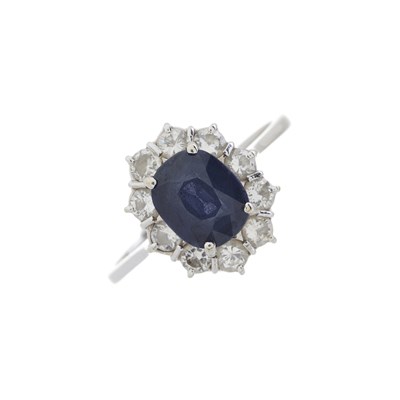 Lot 157 - An 18ct gold sapphire and diamond cluster ring