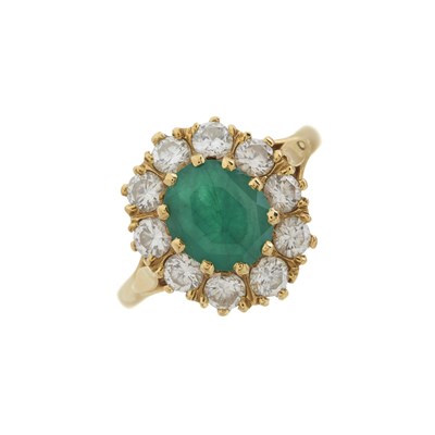 Lot 41 - An 18ct gold emerald and diamond cluster ring