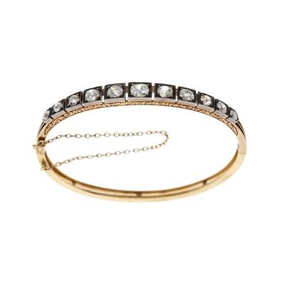 Lot 95 - A late Victorian gold and silver diamond bangle bracelet