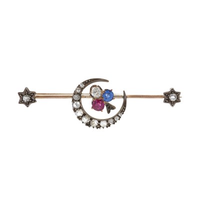 Lot 5 - A late Victorian gold and silver, ruby, sapphire and diamond shamrock crescent brooch