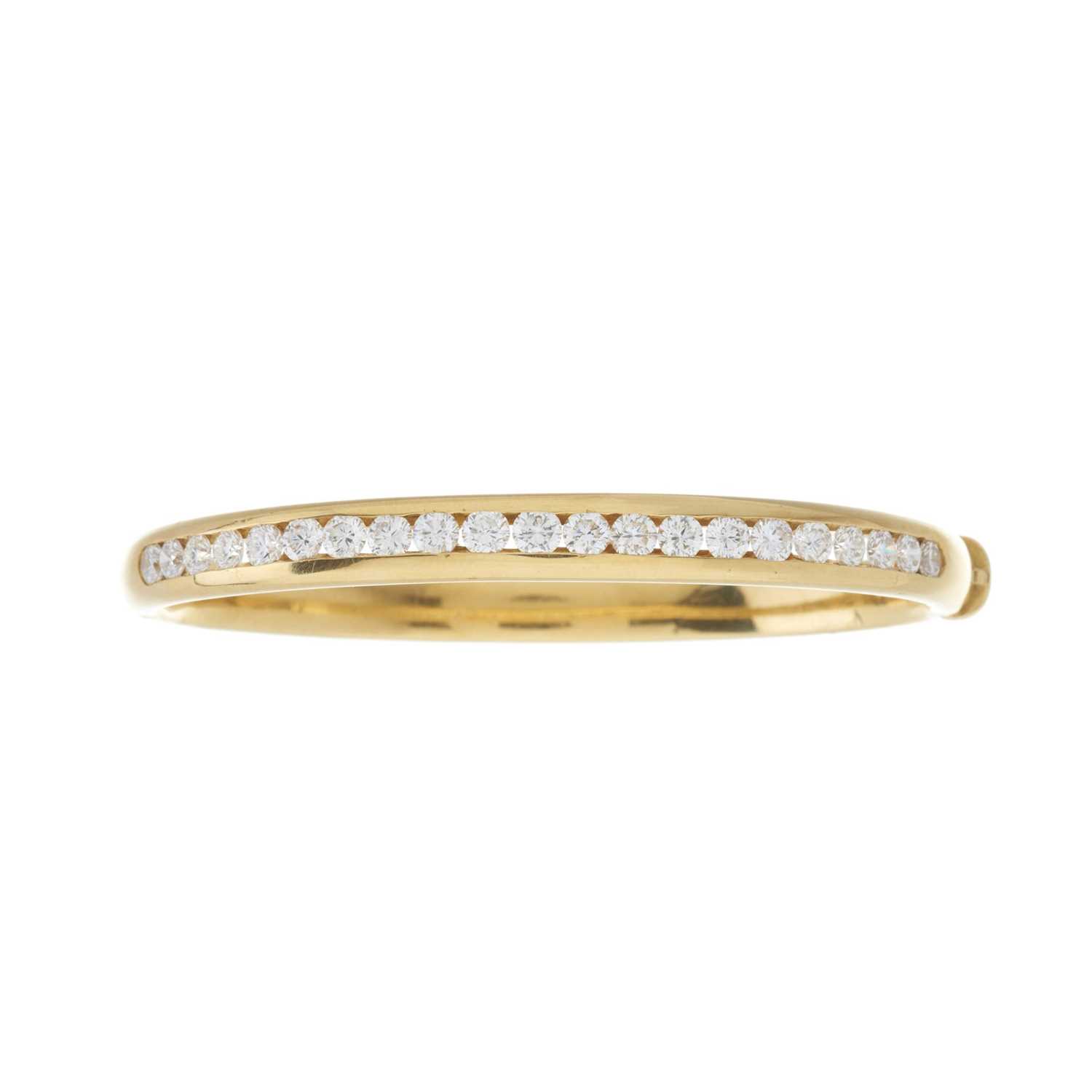 Lot 45 - An 18ct gold diamond line bangle bracelet