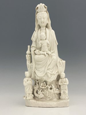 Lot 381 - A Chinese blanc de Chine figure of Guanyin,...