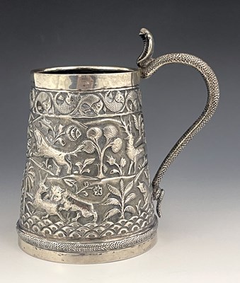 Lot 1 - A large Indian white metal tankard or mug,...