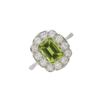 Lot 163 - A platinum peridot and diamond cluster ring