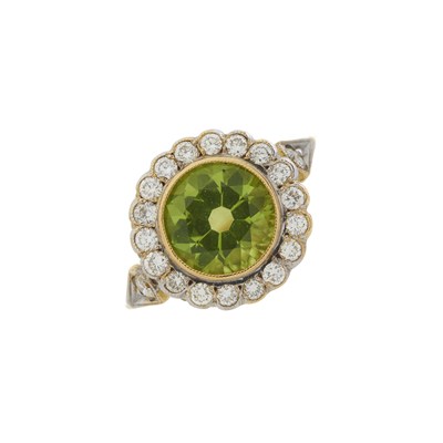 Lot 58 - An 18ct gold peridot and diamond cluster ring